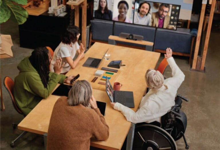 A group of people in conference room on a Teams meeting